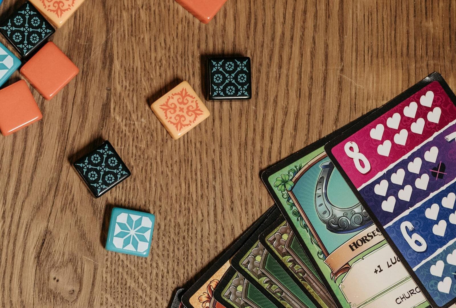 Knight Watch Games in San Antonio: Castle-Themed Tabletop Hub Guide: board game tiles and cards for Knight Watch Games castle-themed guide