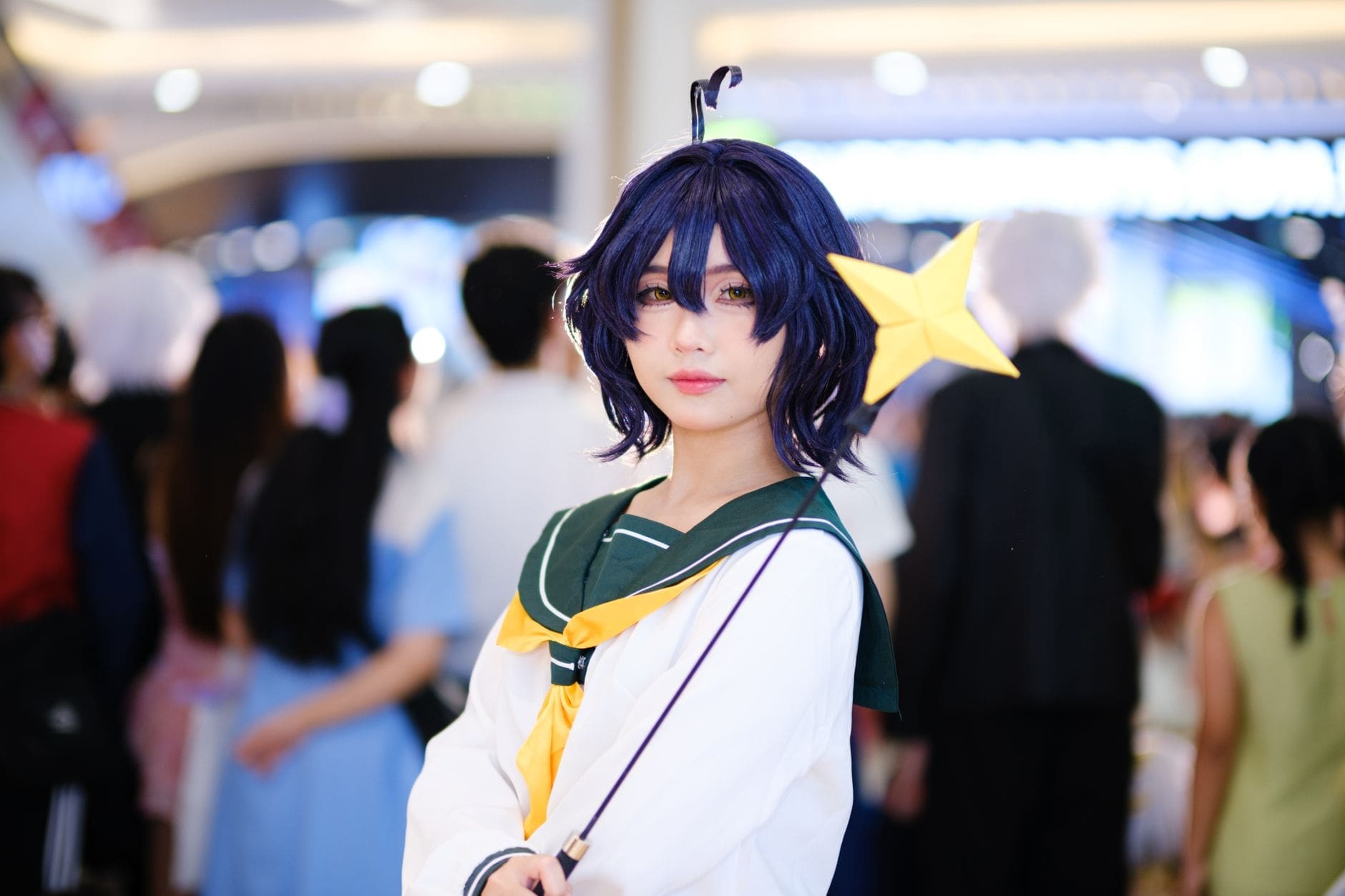 Anime fans in cosplay at a convention hall